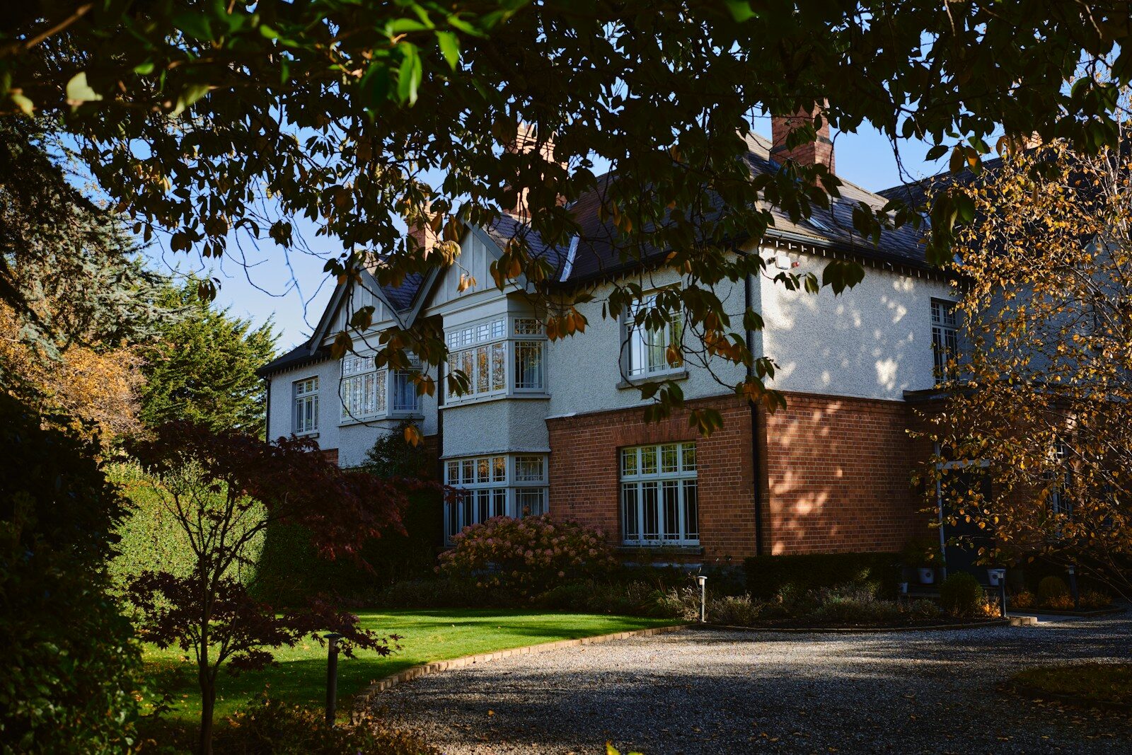 a large house with a driveway in front of it